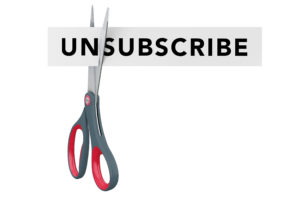 Cutting Unsubscribe to Subscribe Paper Sign with Scissors on a white background
