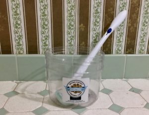 Refillable popcorn tub from Clusters in New Hope, PA being used instead to hold a toilet brush