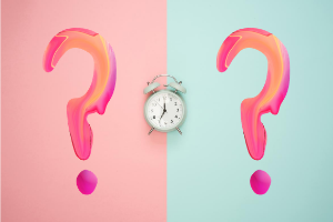 Two pink question marks with alarm clock